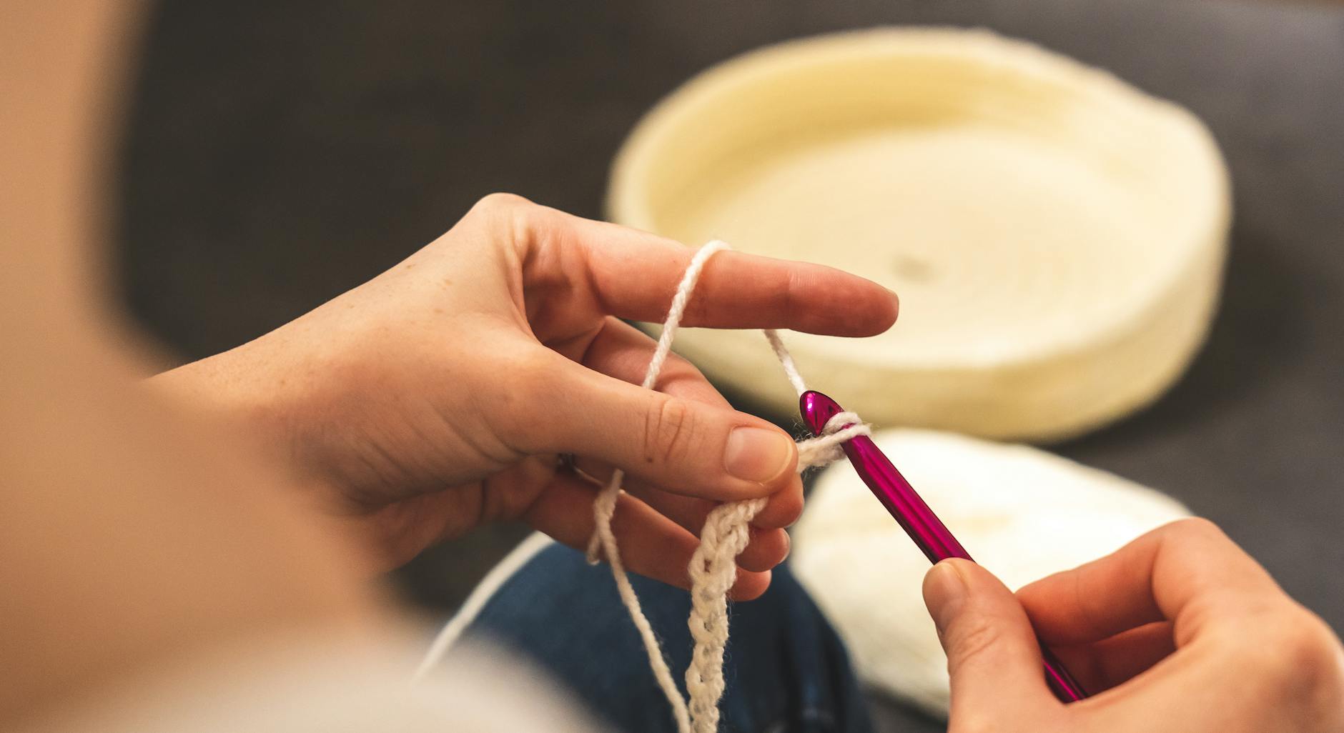 person holding purple and white pen